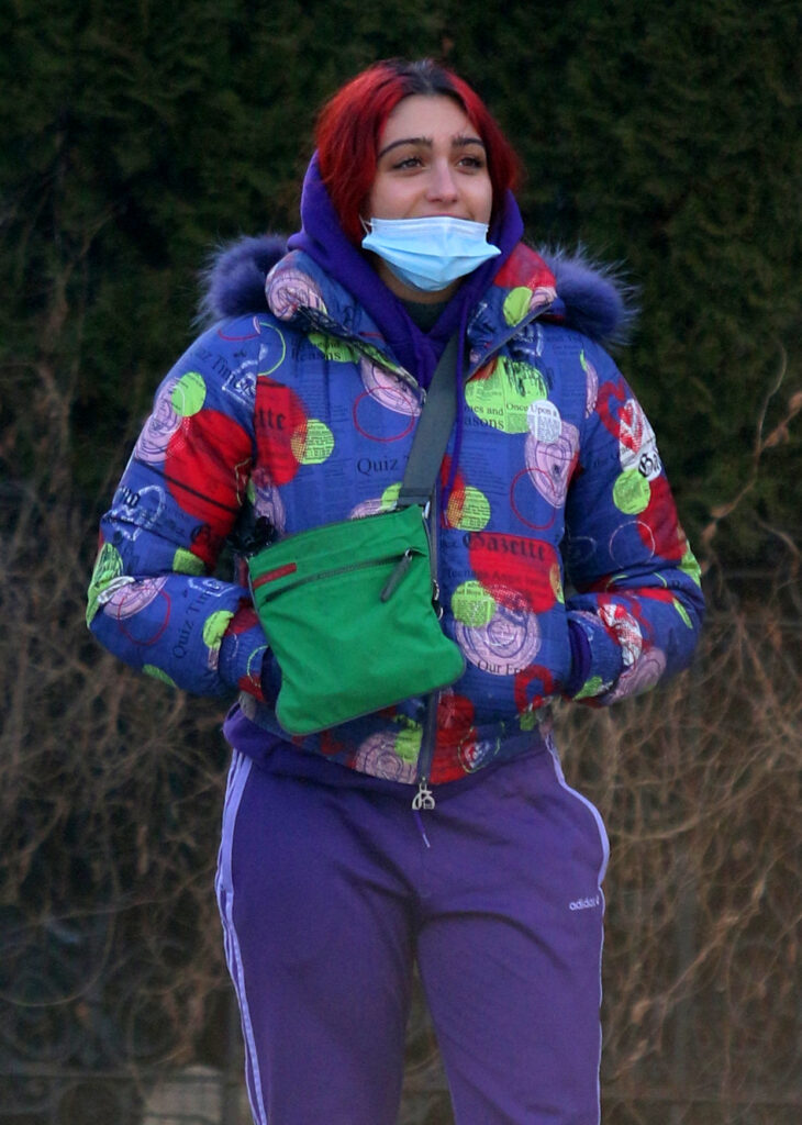 Lourdes Leon sports red hair and a colorful outfit while taking a train ride to Brooklyn in NYC
