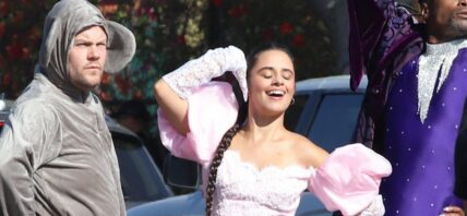 James Corden seems taking a smoke off random strangers joint between takes as he joins Camila Cabello Billy Porter and Idina Menzel in street performance for new movie