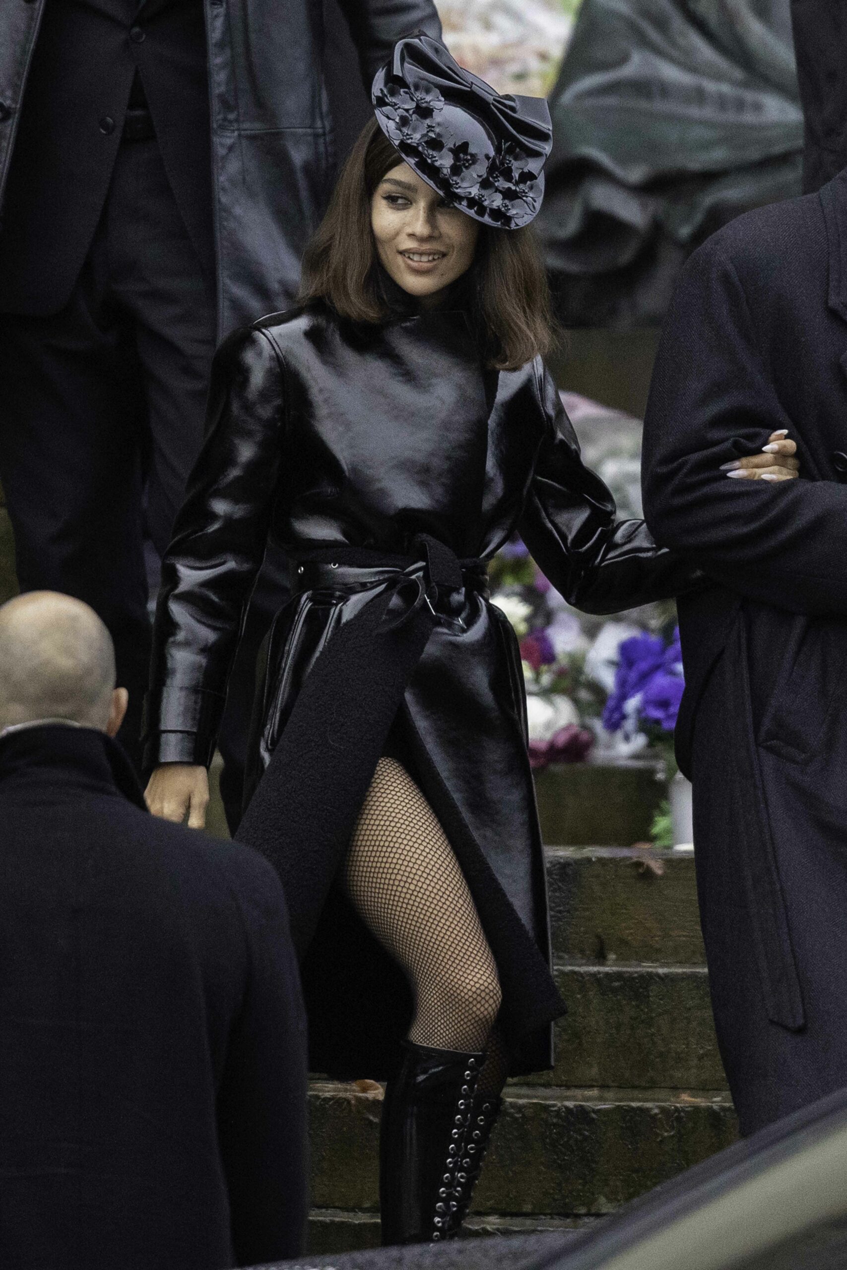 New Catwoman Zoe Kravitz reveals her thigh in fishnet stockings as she films Batman in Liverpool, UK.