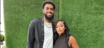 Karl & Jordyn in front of a green wall