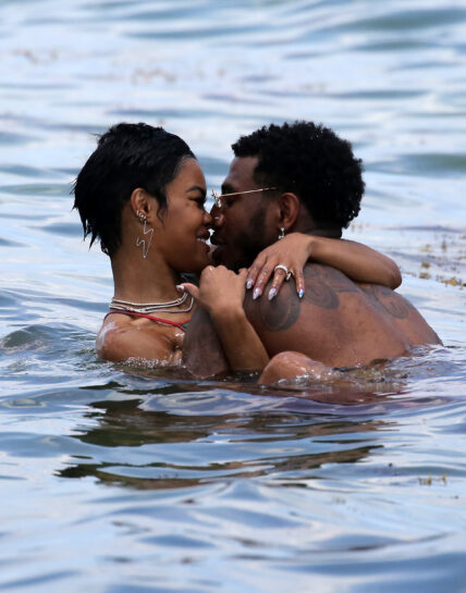 Singer Teyana Taylor wears a tiny mixed match bikini while enjoying 4th of July with family on the beach in Miami