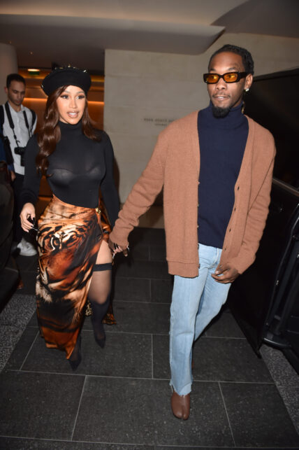 Cardi B shows some serious leg dressed in fishnets and a french beret with boyfriend Offset in Paris