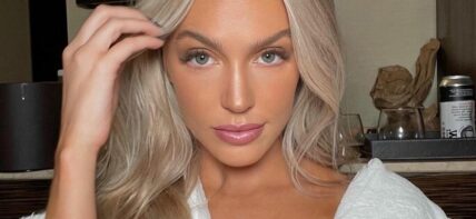 Alex Cooper posing for the camera.