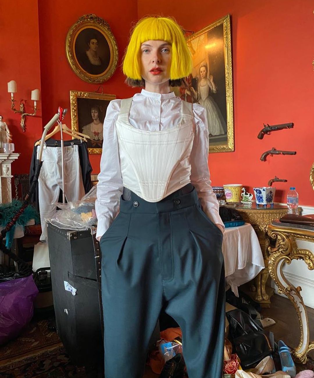 A photo showing Rebecca Ferguson in a colorful hair and outfit.