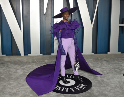 Billy Porter wearing massive purple hat