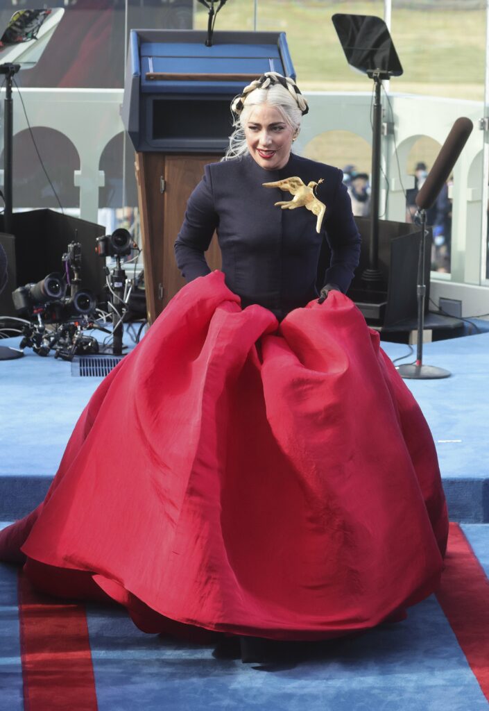 Lady Gaga in a red and black gown 