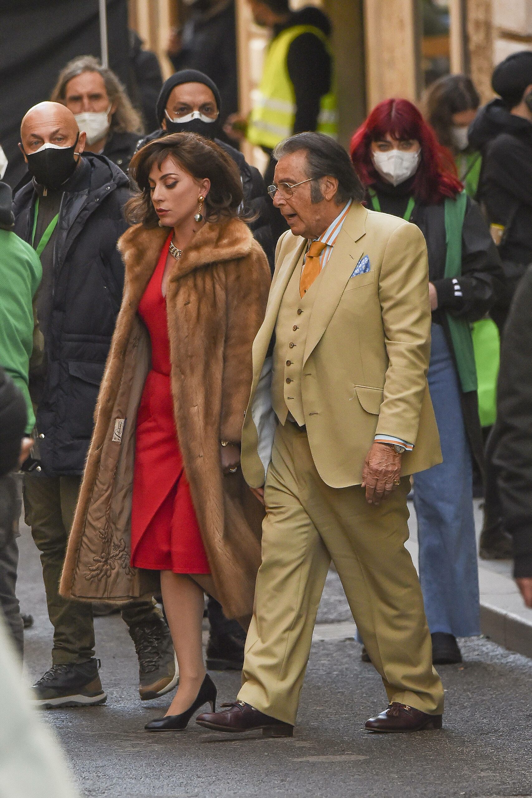Lady Gaga wearing a fur and Al Pacino filming House of Gucci in Rome, Italy