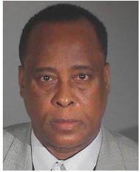 Dr. Conrad Murray listens as Judge Michael Pastor sentences him to four years
