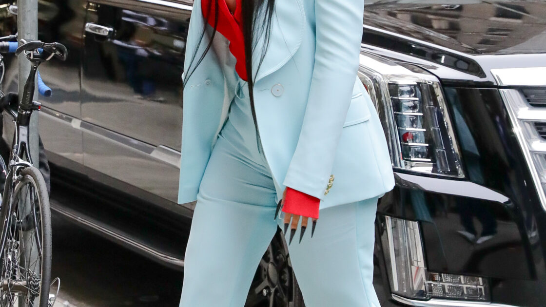 Cardi B looks looks radiant in a light blue suit as arriving at an office building in NYC