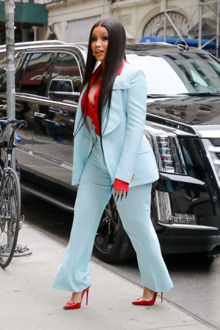 Cardi B looks looks radiant in a light blue suit as arriving at an office building in NYC