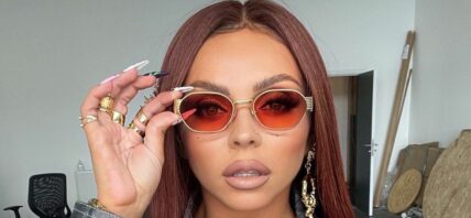 Jesy Nelson wearing red sunglasses