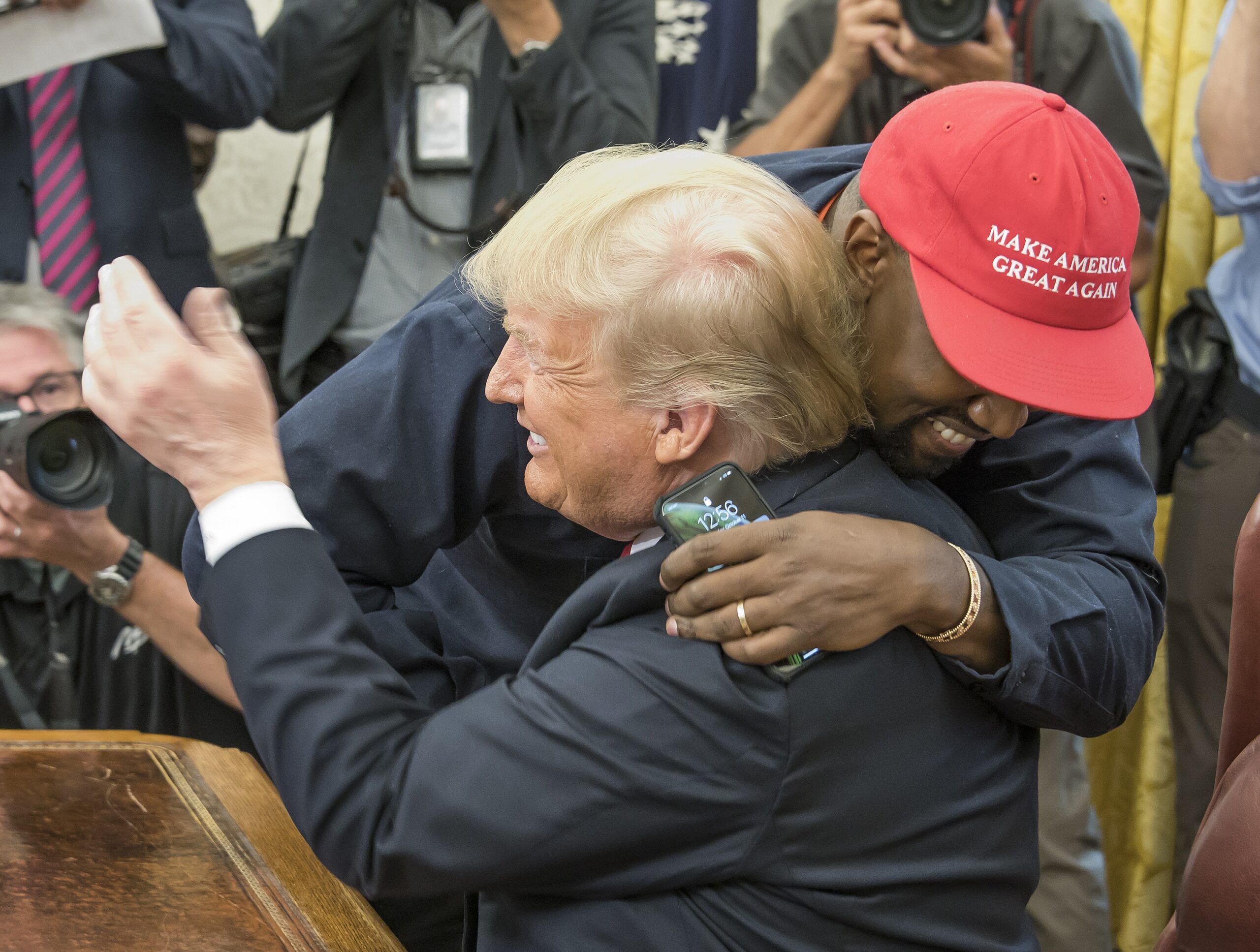 Kanye West hugs United States President Donald J. Trump hugs they meet the Oval Office of the White House in