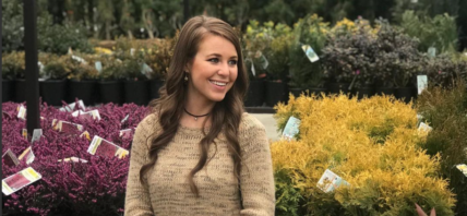 Jana Duggar in a garden