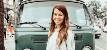 Jana Duggar in front of VW van