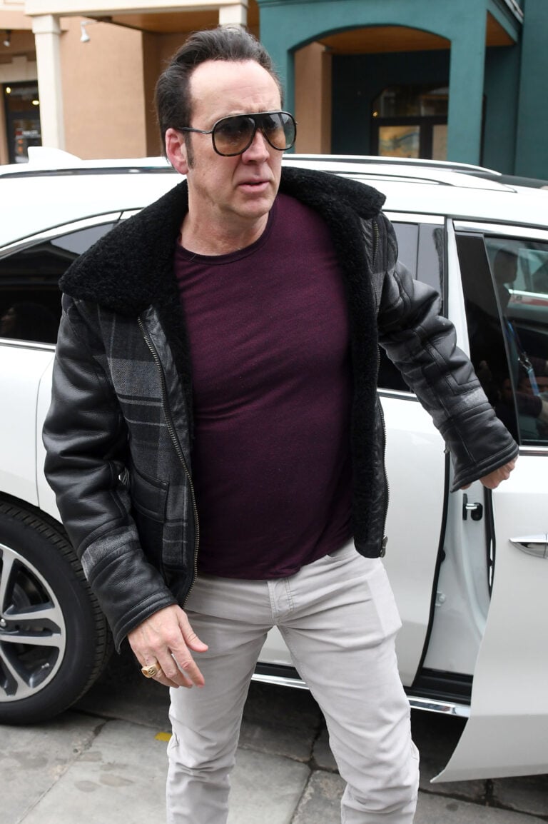 Nic Cage looks stylish in sunglasses and white pants as he promotes apos Mandy apos at Sundance