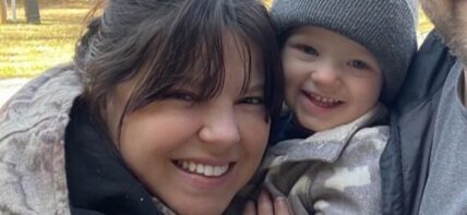 Amy Duggar with husband and son