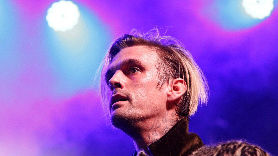 Aaron Carter performing on stage.