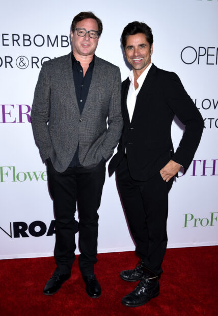 Bob Saget and John Stamos smiling.