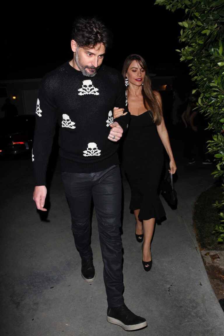 Sof a Vergara and Joe Manganilla walk happily together as they attend Jennifer Klein apos s house party