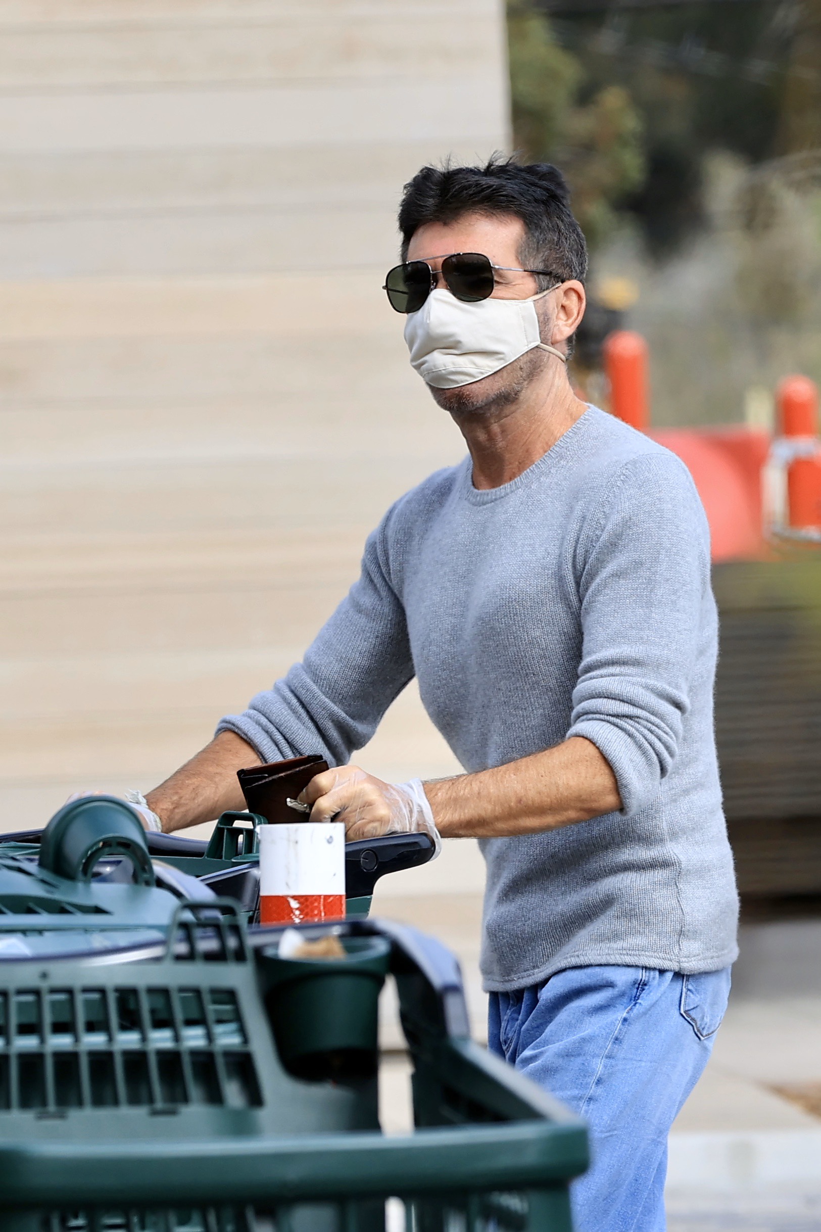 Simon Cowell wears a mask grocery shopping
