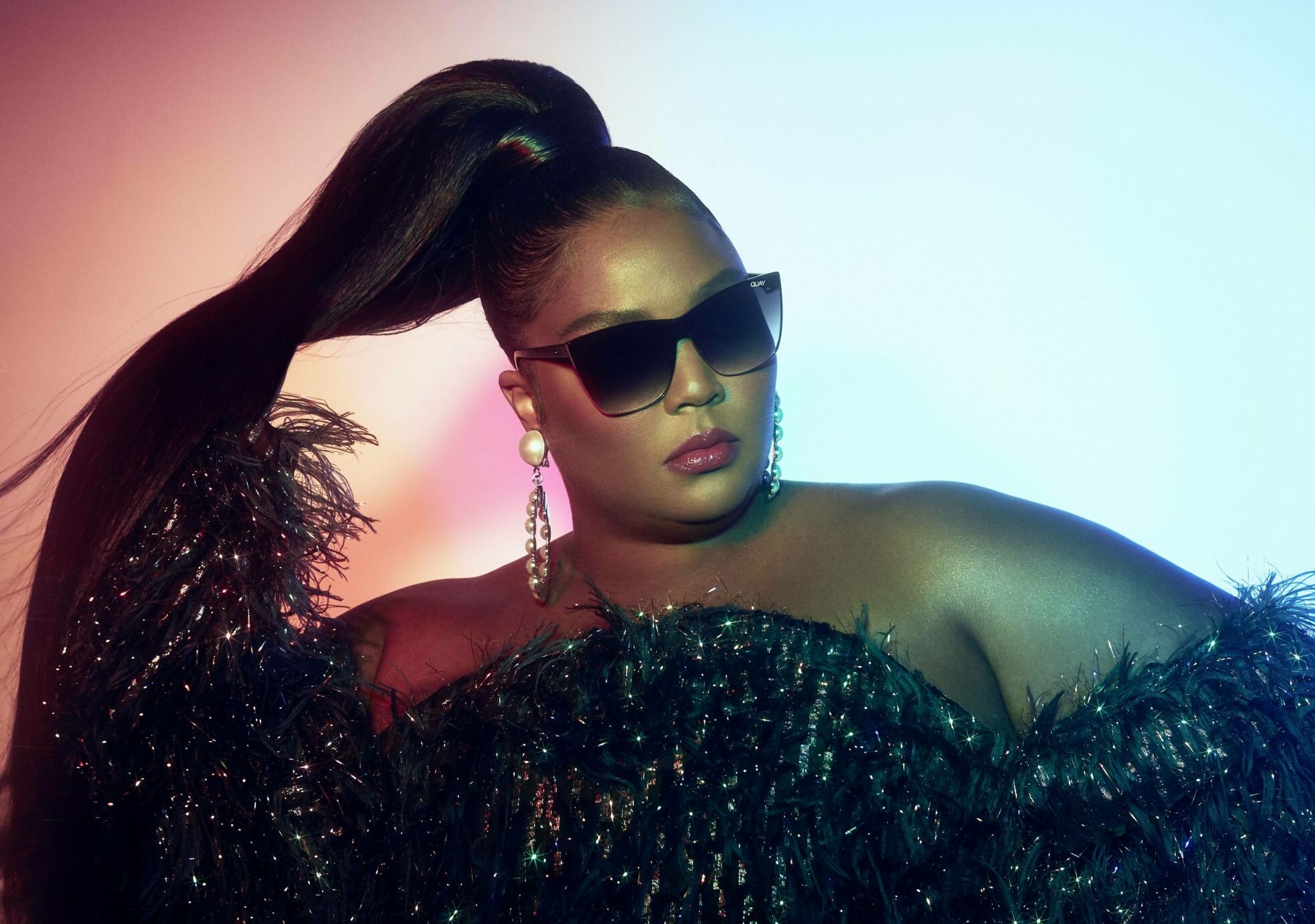 Lizzo shows off her 'specs' appeal - as she models a new eyewear collection.