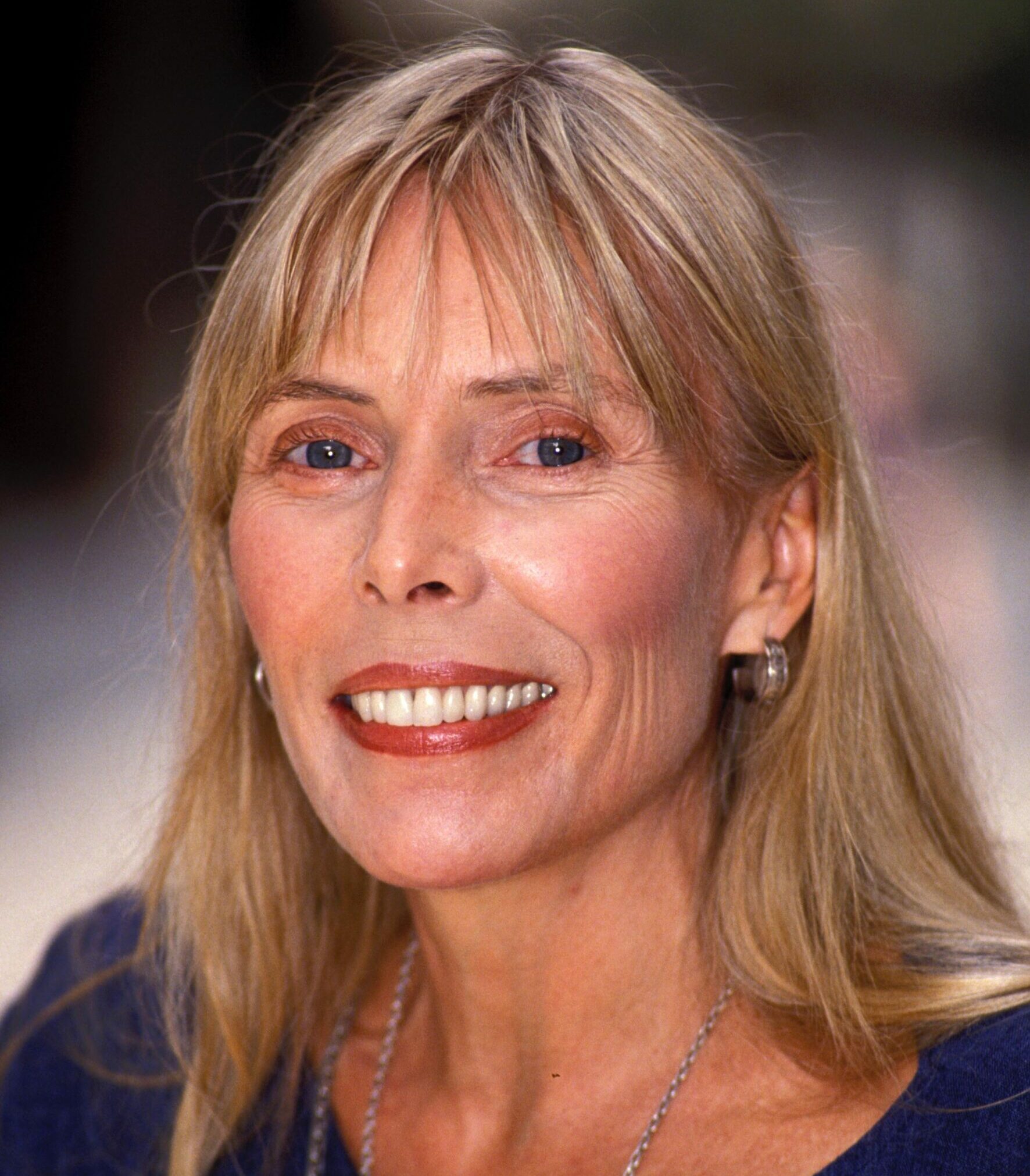 JONI MITCHELL smoking cigarette, sandals