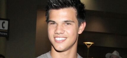 TAYLOR LAUTNER AT LAX