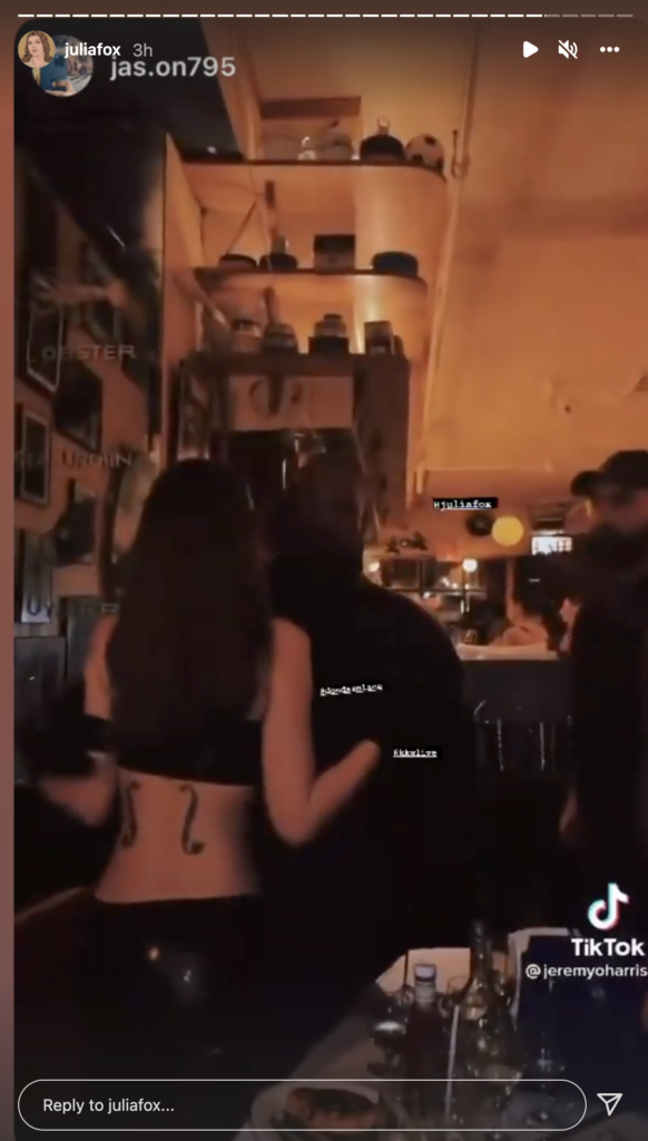 Julia Fox and Kanye West kissing.