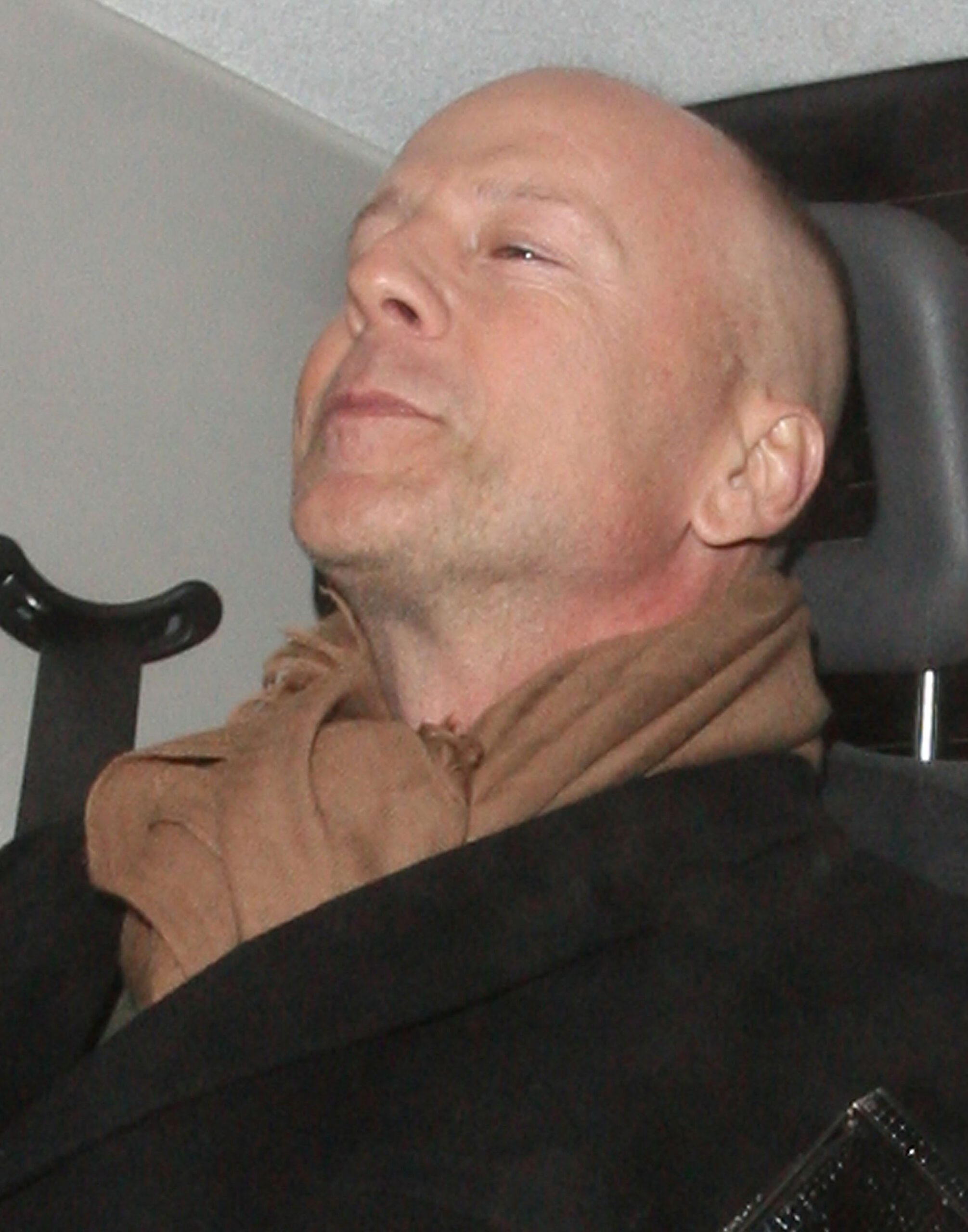 Bruce Willis and his new girlfriend Emma Heming arrive back at the Covent Garden Hotel in a black cab having had had dinner at The Ivy restaurant