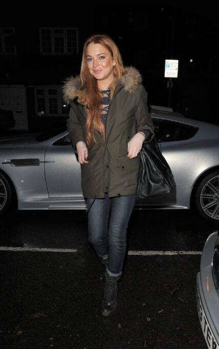 Lindsay Lohan leaves a friends house and heads to a friends house in West London to celebrate their birthday