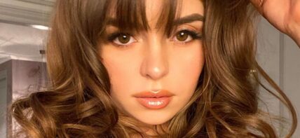 Demi Rose taking a selfie.