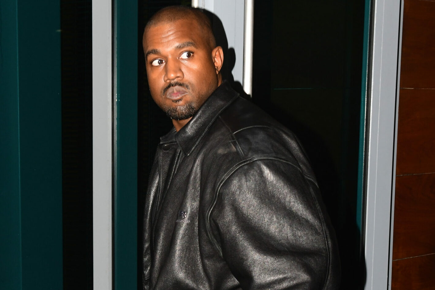 Kanye West is back in his boots as he makes his way around Miami.