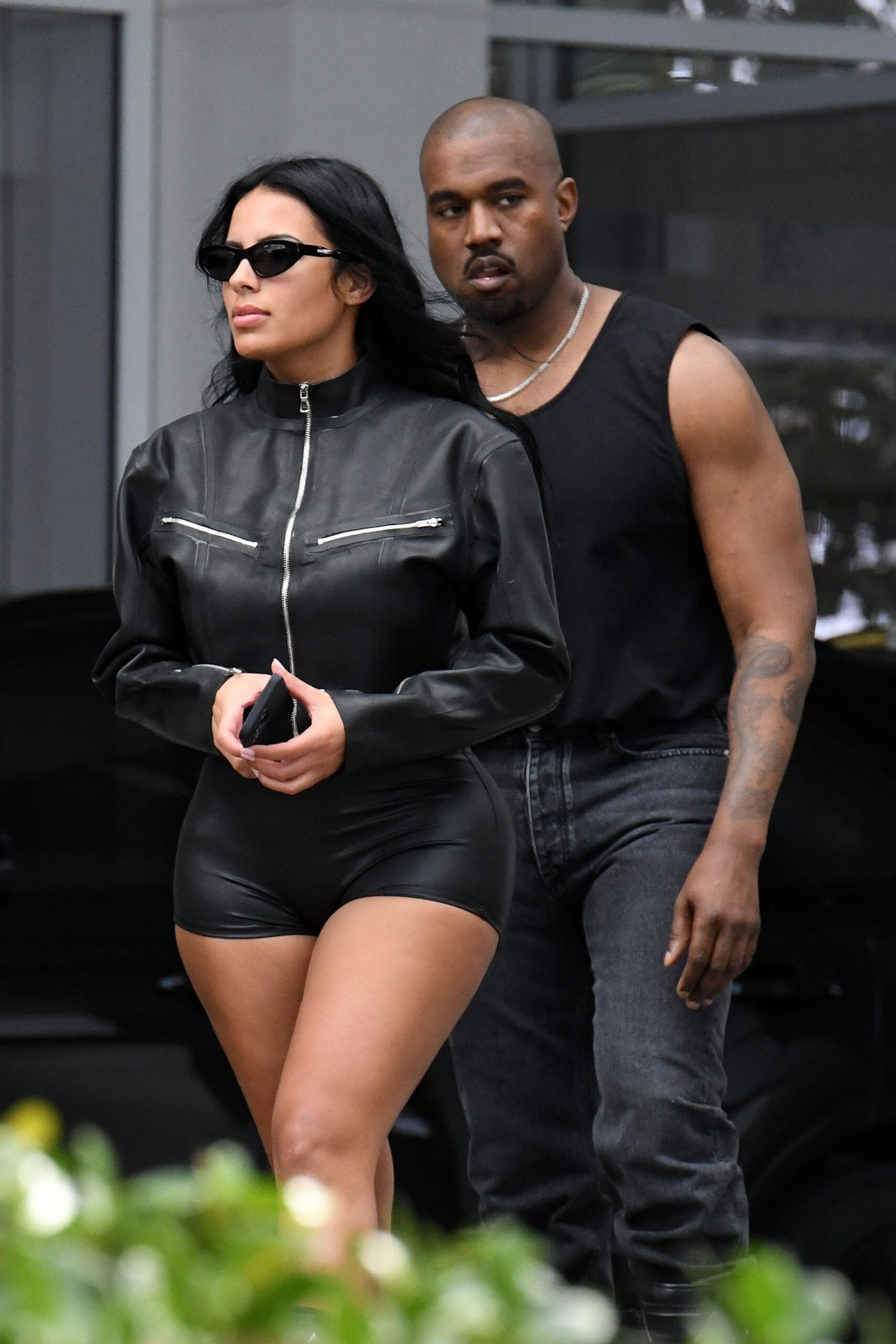 A newly single Kanye West is seen leaving his hotel with new girlfriend Chaney Jones in Miami