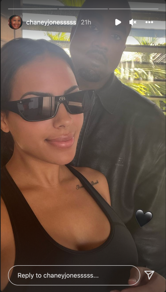 Kanye West smiling with Chaney Jones