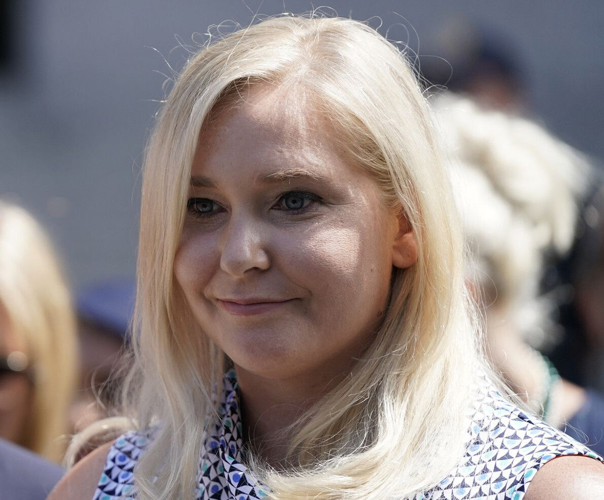 One of Jeffrey Epstein's alleged victims, Virginia Roberts Giuffre, right, speaks at a news conference following a hearing where Epstein's alleged victims made statements in Manhattan Federal Court on Aug. 27, 2019, in New York.