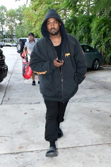 Kanye West is seen for the first time since becoming legally single as he hits up a tattoo shop in Miami
