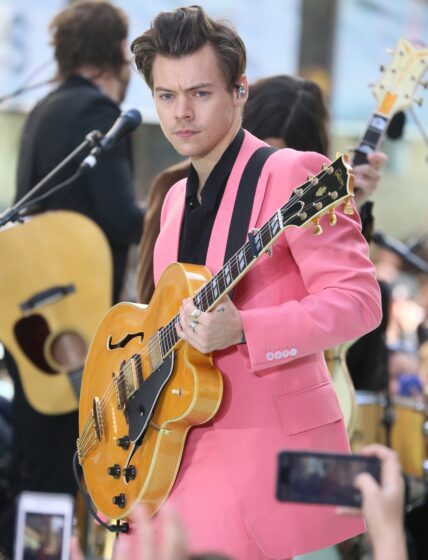 Harry Styles performs on the "Today Show" in New York City wearing pink suit.
