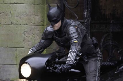 Robert Pattinson's stunt double dressed as Batman rides a motorbike in Liverpool.