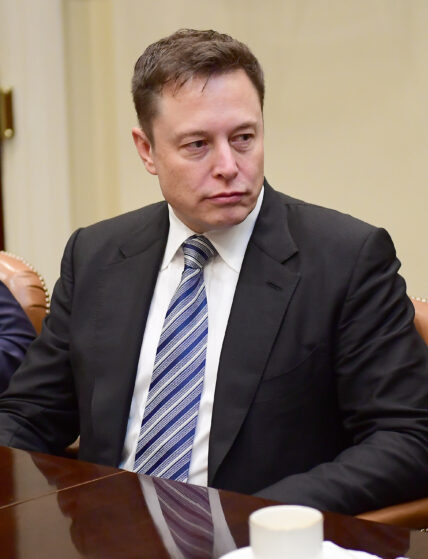 Elon Musk of Space X listens as United States President Donald Trump makes remarks during a breakfast and listening session with key business leaders in the Roosevelt Room of the White House in Washington, DC on Monday, January 23, 2017.