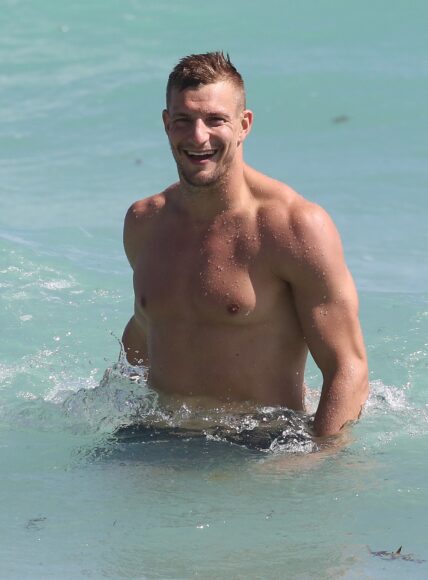 Shirtless Rob Gronkowski takes a dip in the ocean in Miami