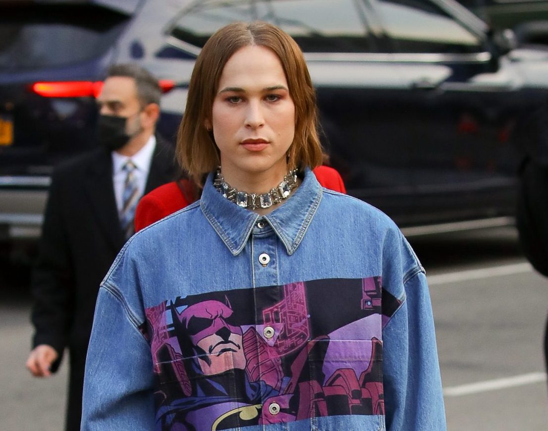 Tommy Dorfman wears a denim dress while attending at the The Batman premiere in New York City on Mar 01 2022