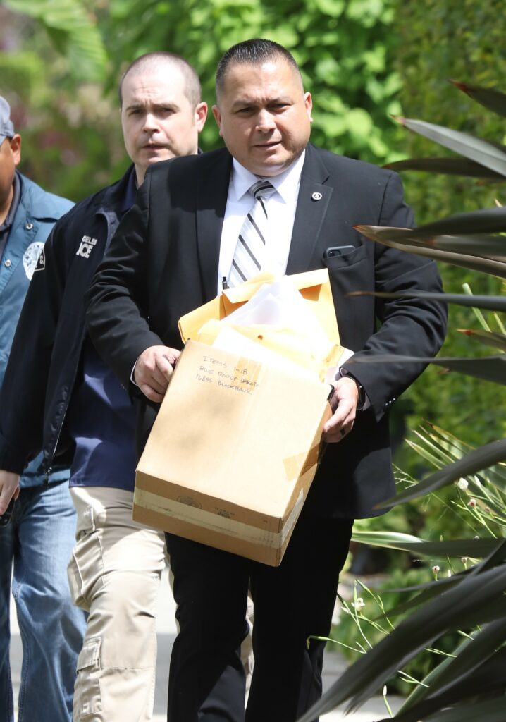 Gangs and Narcotics investigators are seen leaving the A AP residence