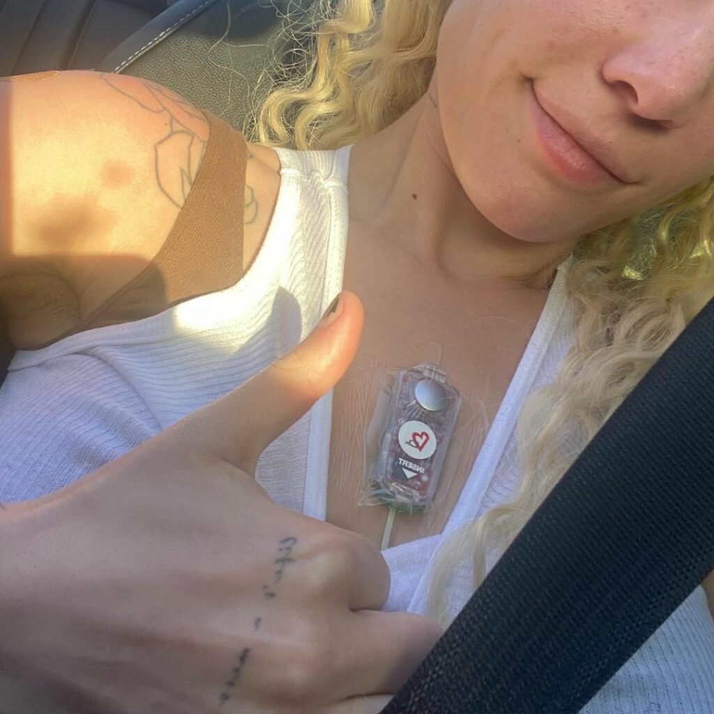 Halsey wearing a heart monitor