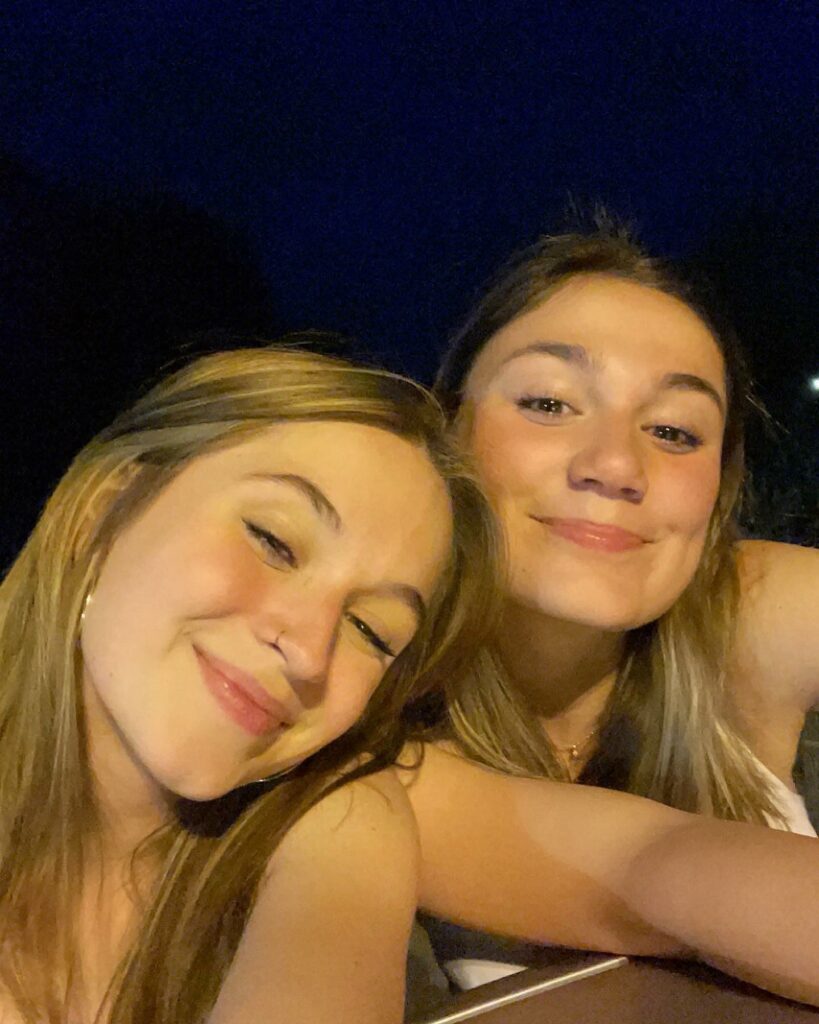 Ella Wahlberg and her friend smiling.