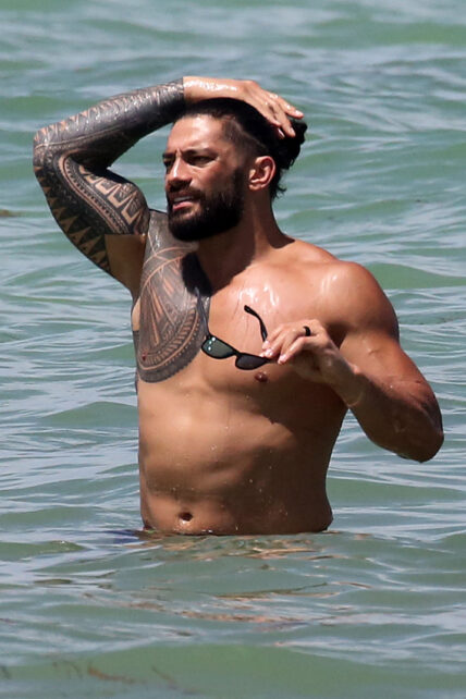 Roman Reigns flexes in ocean