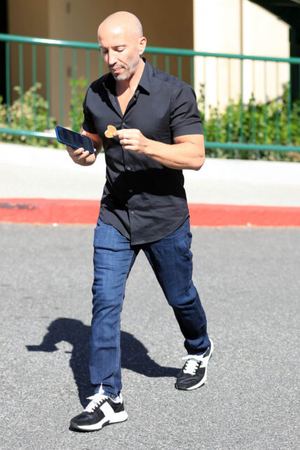 Jason Oppenheim is seen walking and talking in Los Angeles