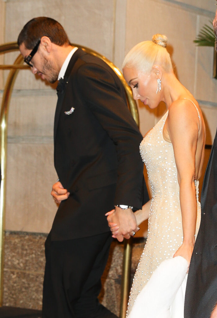 Kim Kardashian and Pete Davidson hold hands while arriving back at their Ritz-Carlton Hotel after attending The MET Gala in New York City