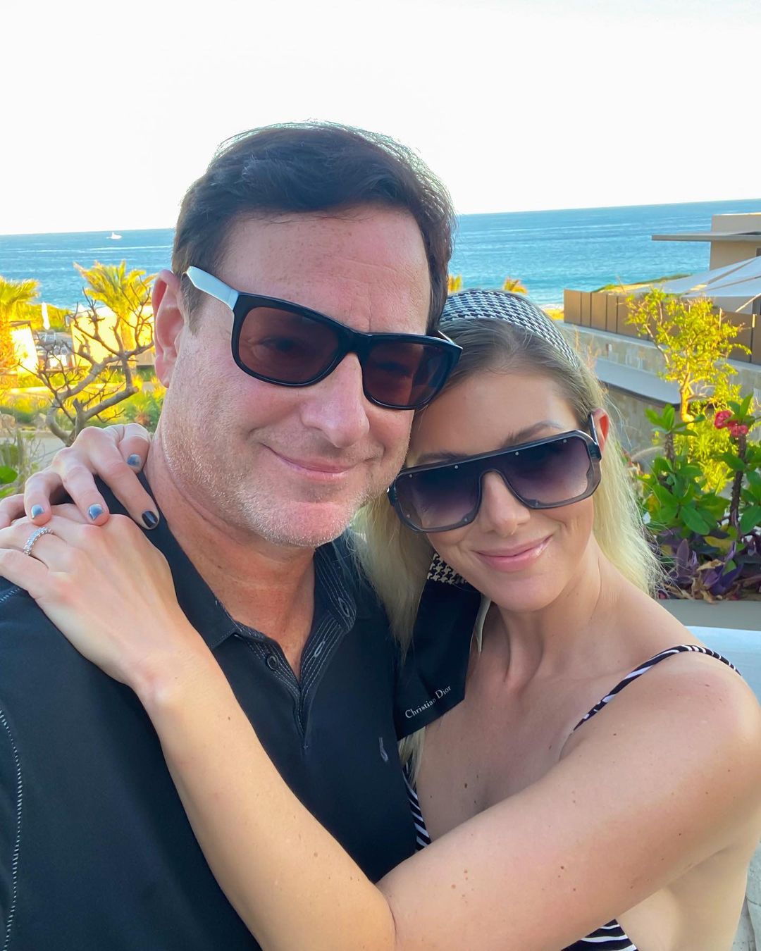Bob Saget and Kelly Rizzo smiling.