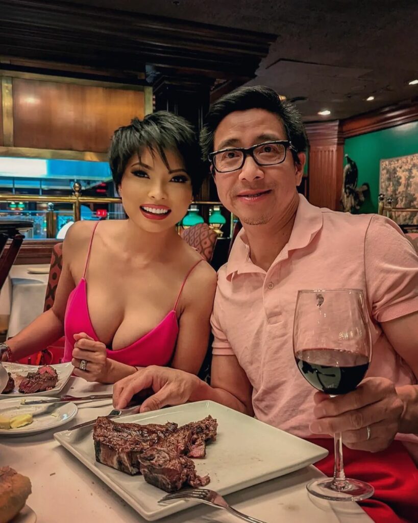 Jennie Nguyen and her husband posing for the camera.