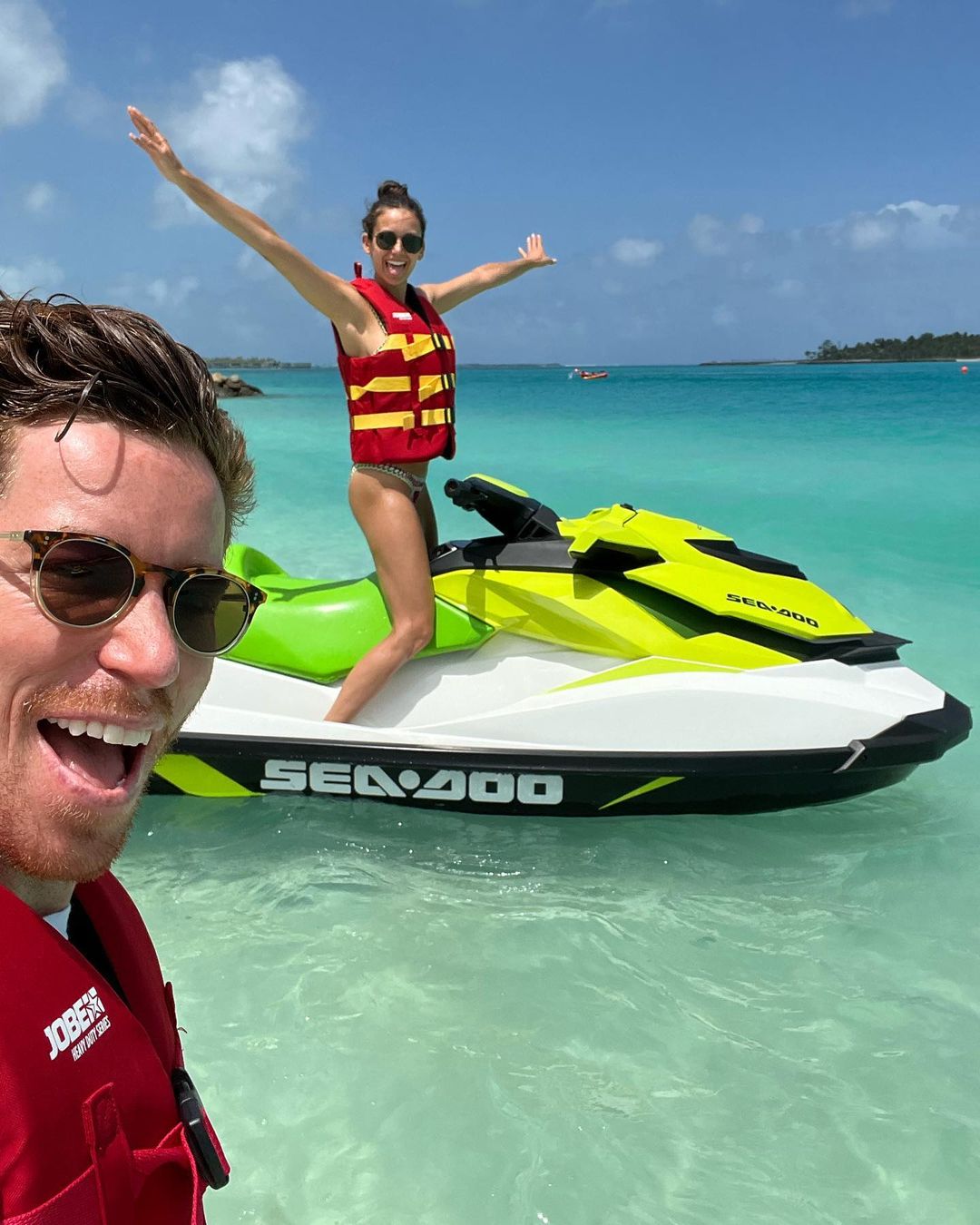 Shaun White and Nina Dobrev smiling.